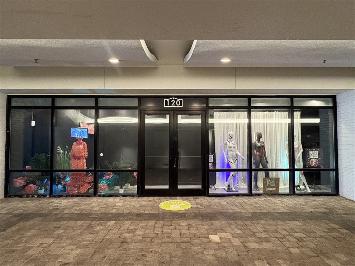 Storefront window with art installation using mannequins 
