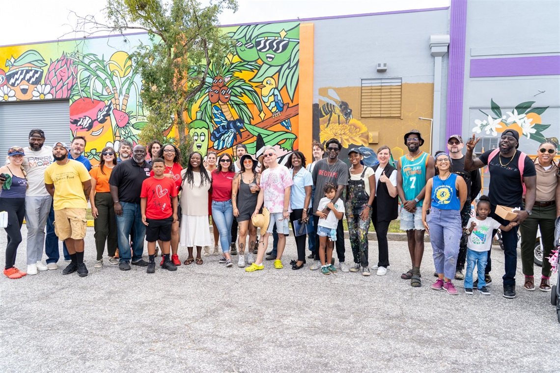 A large group of people in front of Murals on Church Street